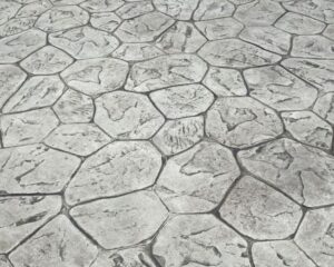 a close up of stamped concrete with a pattern resembling a cityscape.