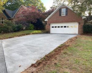 Brick house with clean concrete driveway