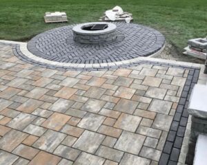Circular stone patio with fire pit