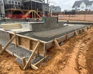 Residential pool construction site near backyard.
