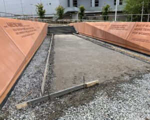 Pathway with engraved quotes and unfinished construction