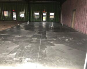 Interior concrete floor in unfinished building space.