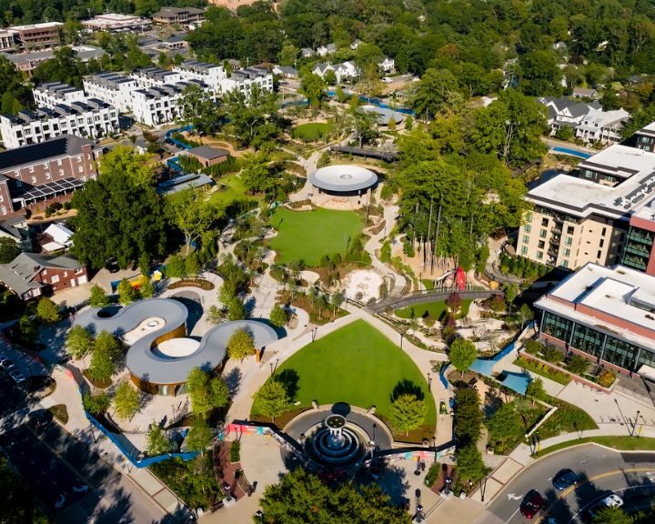Aerial view of landscaped park with modern buildings.