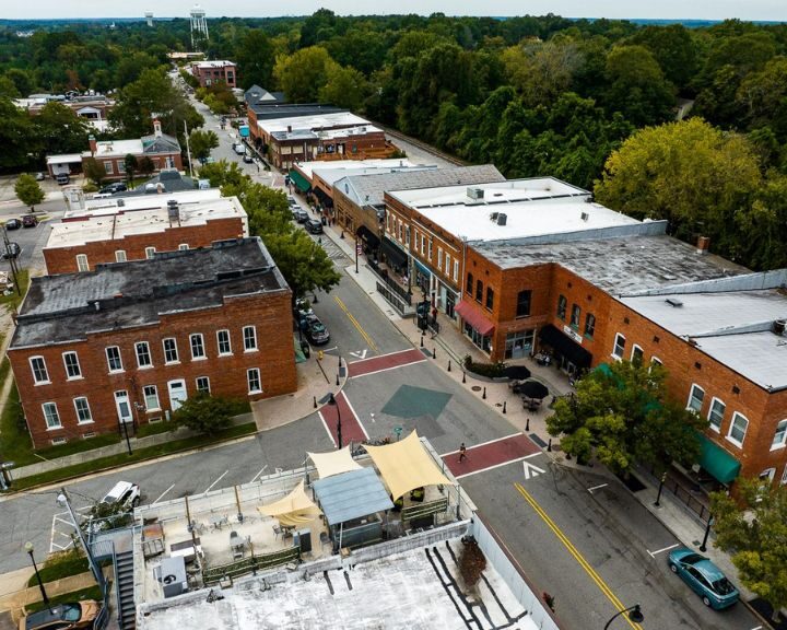 Aerial view of a small downtown area with shops.